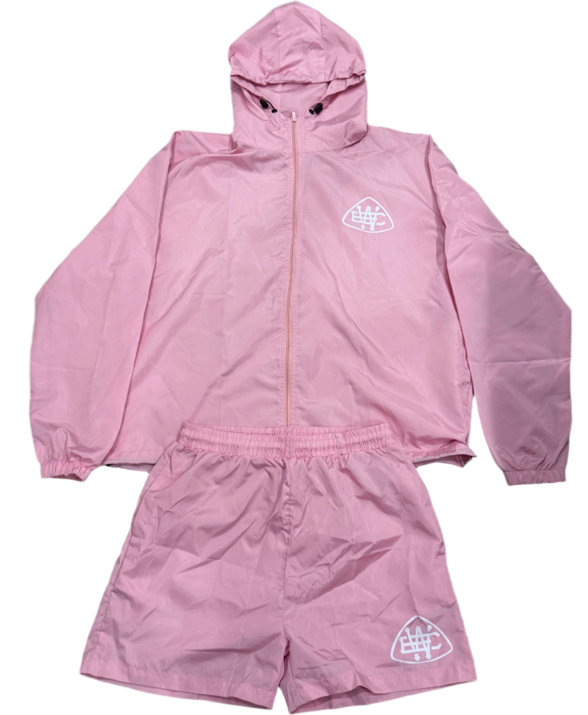 Light pink Unerring set featuring a drawstring hood, elastic cuffs, and bold white logo, perfect fit for stylish comfort.