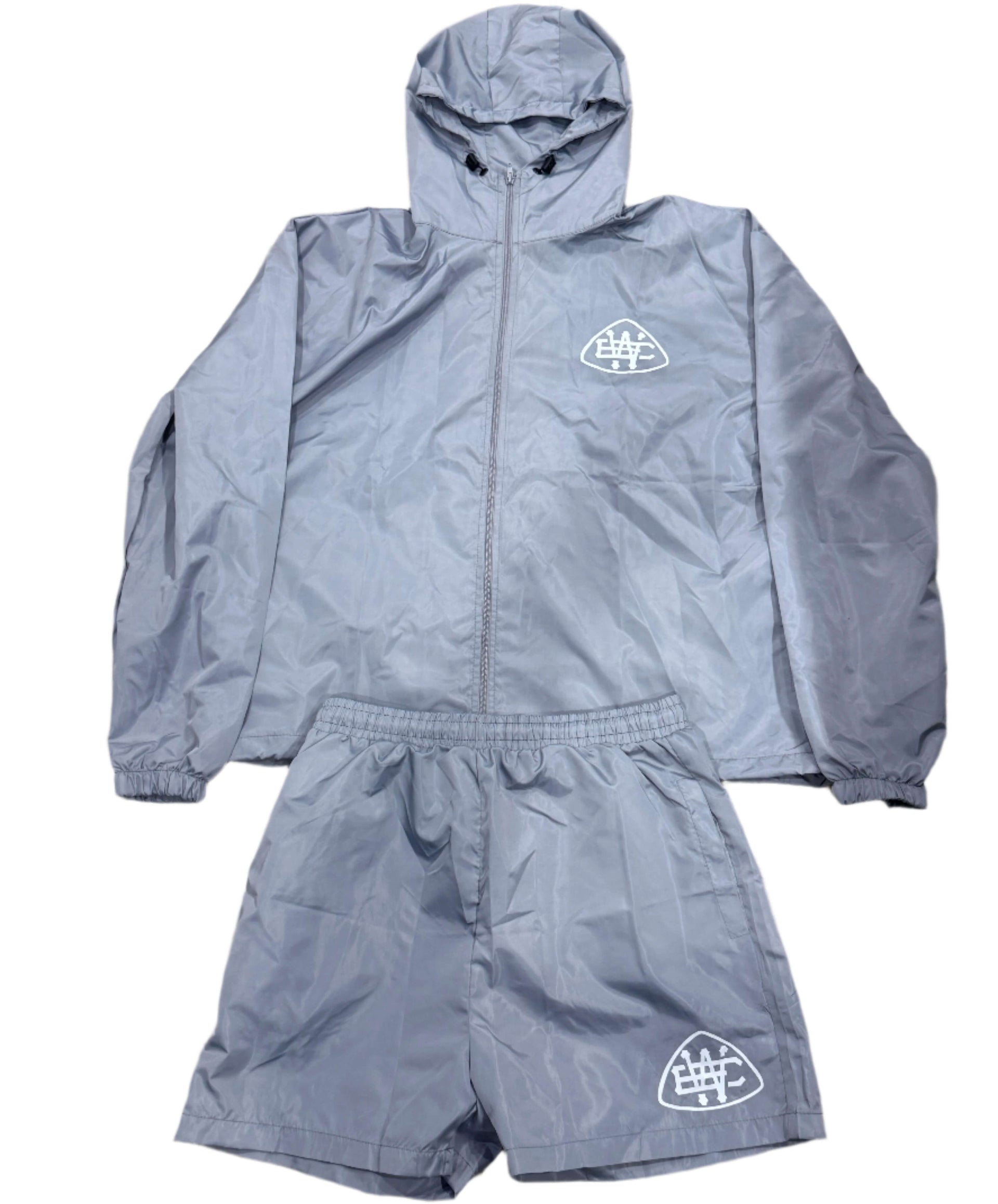 Grey Unerring Set featuring a drawstring hood, elastic cuffs, and bold white logo, perfect for true-to-size fit.